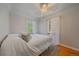 Bedroom with windows, light colored walls, and light bedding at 2065 Leyden St, Denver, CO 80207