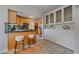 Open kitchen with breakfast bar, stainless steel appliances, and modern cabinetry at 2065 Leyden St, Denver, CO 80207