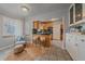 Charming kitchen nook with breakfast bar, tiled floor, and a comfortable seating area at 2065 Leyden St, Denver, CO 80207