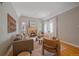 Bright living room features fireplace, hardwood floors, and neutral paint scheme at 2065 Leyden St, Denver, CO 80207