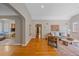 Inviting living room with hardwood floors, fireplace, and open archway at 2065 Leyden St, Denver, CO 80207