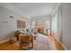Bright living room features fireplace, hardwood floors, and neutral paint scheme at 2065 Leyden St, Denver, CO 80207