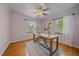 Office space with hardwood floors, natural light from two windows, and modern decor at 2065 Leyden St, Denver, CO 80207