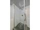 Bathroom showcasing a tiled shower with a glass door, accented by modern fixtures and hexagon tile base at 2065 Leyden St, Denver, CO 80207