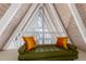 Cozy attic nook with a unique A-frame window, stylish seating and ample light at 6365 Highway 9, Breckenridge, CO 80424