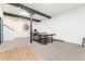 Finished basement featuring a ping pong table, stylish gray support beams, and neutral carpeting at 6365 Highway 9, Breckenridge, CO 80424