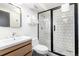 Modern bathroom featuring a glass-enclosed shower, sleek vanity, and modern fixtures at 6365 Highway 9, Breckenridge, CO 80424