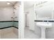Bathroom featuring tiled walk-in shower and pedestal sink at 6365 Highway 9, Breckenridge, CO 80424