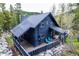 Charming mountain cabin featuring a metal roof, wood siding, and scenic wooded surroundings at 6365 Highway 9, Breckenridge, CO 80424