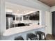 Modern kitchen featuring stainless steel appliances, stone counters and a stylish breakfast bar at 6365 Highway 9, Breckenridge, CO 80424