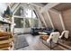 Spacious living room with a cozy fireplace and stunning outdoor views at 6365 Highway 9, Breckenridge, CO 80424