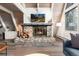 Inviting living room with stone fireplace and wooden accents, creating a cozy and rustic atmosphere at 6365 Highway 9, Breckenridge, CO 80424