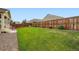Lush green backyard showcasing a well-maintained lawn, privacy fence, and ample space for recreation at 16043 Fillmore St, Thornton, CO 80602