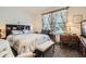 Bedroom with a bed, floral curtains, side tables, and carpeted floors at 16043 Fillmore St, Thornton, CO 80602