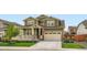 Well-maintained two story home with a manicured lawn and an attached two car garage at 16043 Fillmore St, Thornton, CO 80602