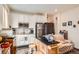 Kitchen area featuring stainless steel appliances, white cabinets, tiled backsplash, and an island with a butcher block top at 16043 Fillmore St, Thornton, CO 80602