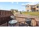 Outdoor deck space with patio seating and views of the surrounding grassy grounds at 1747 High Plains Ct, Superior, CO 80027
