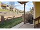 Outdoor patio area with a view of well-maintained grass and a row of townhomes at 1747 High Plains Ct, Superior, CO 80027
