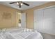 Neutral bedroom featuring natural light, a comfortable bed, and closet space at 1747 High Plains Ct, Superior, CO 80027
