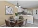 Cozy dining area adjacent to the kitchen, featuring a modern table and stylish lighting at 1747 High Plains Ct, Superior, CO 80027