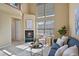 Inviting living room featuring a fireplace, a comfortable couch, and natural light at 1747 High Plains Ct, Superior, CO 80027