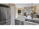 Open-concept living area with stainless steel appliances and a cozy fireplace at 1747 High Plains Ct, Superior, CO 80027