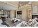Open-concept living space featuring a fireplace, a staircase, and seamless flow to the kitchen at 1747 High Plains Ct, Superior, CO 80027