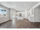 Modern kitchen features white cabinets, an island, and stainless steel appliances at 1385 Bloom St, Brighton, CO 80601
