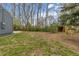Spacious backyard features mature trees, green grass, and a storage shed at 3230 Vance St, Wheat Ridge, CO 80033