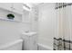 Classic bathroom with white subway tile, a shower/tub combination, and storage at 3230 Vance St, Wheat Ridge, CO 80033