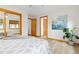 The bright, modern bedroom has a view of the closets and mirror at 3230 Vance St, Wheat Ridge, CO 80033