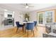 Dining area with doors to the yard is adjacent to the modern kitchen at 3230 Vance St, Wheat Ridge, CO 80033
