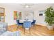 Stylish dining room with bright decor including a colorful piece of art at 3230 Vance St, Wheat Ridge, CO 80033