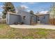 The exterior features a concrete patio, outdoor seating and fresh, dark siding at 3230 Vance St, Wheat Ridge, CO 80033