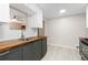 Well-lit kitchen showcasing butcher block countertops, sleek appliances, stylish cabinets, and modern sink fixtures at 3230 Vance St, Wheat Ridge, CO 80033