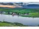 Aerial view of a lakeside community showcasing stunning homes and serene waterfront living at 6234 Nautique Cir, Larkspur, CO 80118