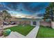 Beautiful backyard features a deck, turf grass, cornhole game, and string lights for evening entertainment at 6234 Nautique Cir, Larkspur, CO 80118