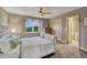 Bedroom with modern decor, neutral colors, and ample natural light at 6234 Nautique Cir, Larkspur, CO 80118