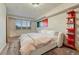 Comfortable bedroom featuring a large window and modern decor at 6234 Nautique Cir, Larkspur, CO 80118
