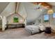 Cozy bedroom with a sloped ceiling, exposed beams, and scenic views at 6234 Nautique Cir, Larkspur, CO 80118