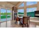 Bright dining area with views, hardwood floors, and modern finishes at 6234 Nautique Cir, Larkspur, CO 80118