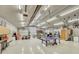 Spacious garage featuring high ceilings, ample lighting, and workshop area at 6234 Nautique Cir, Larkspur, CO 80118