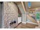 Hallway with stylish fireplace and modern staircase with unique details at 6234 Nautique Cir, Larkspur, CO 80118
