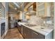 Modern kitchen featuring stainless steel appliances, marble countertops, and designer backsplash at 6234 Nautique Cir, Larkspur, CO 80118