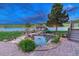 Beautiful pond with stone features, landscaping, and water feature for a peaceful backyard retreat at 6234 Nautique Cir, Larkspur, CO 80118