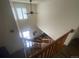 Foyer featuring a high ceiling and hardwood railing at 14828 E Pacific Pl, Aurora, CO 80014