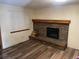 Living room with beautiful floors and brick fireplace at 14828 E Pacific Pl, Aurora, CO 80014