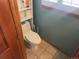 Toilet sits in a small room at 14828 E Pacific Pl, Aurora, CO 80014