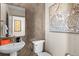 Stylish powder room with modern fixtures and herringbone tile at 6020 N Orleans St, Aurora, CO 80019