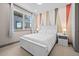 Cozy bedroom with white furniture and accent wall at 6020 N Orleans St, Aurora, CO 80019